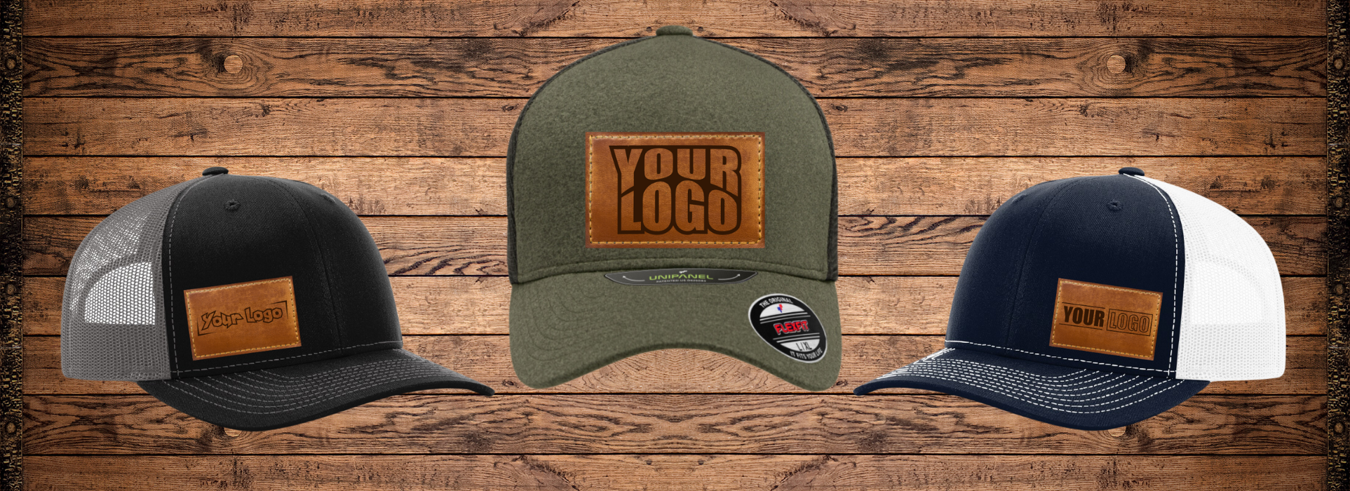 Three Trucker hats with leather patches that read "Your logo here" on a rustic wood background.